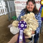 Squires takes home supreme champion ribbons for Angora goat and sheep fleece