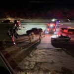 Truck with 5th wheel hauling cars flips over onto I-15 from ramp causing major delays