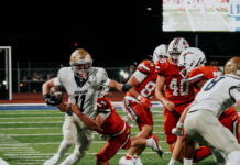 Local prep football teams battle through Week Zero season openers