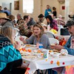 Student volunteers join local community in heartwarming Thanksgiving dinner gathering