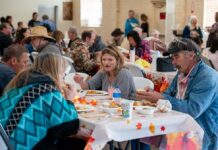 Student volunteers join local community in heartwarming Thanksgiving dinner gathering