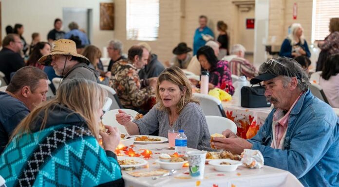 Student volunteers join local community in heartwarming Thanksgiving dinner gathering