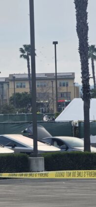 Numerous Tesla vehicles for technicians parked near the battery.