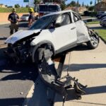 Driver Ejected on I-15; Empty Vehicle Launches Over Wall onto Residential Sidewalk The vehicle the rolled then launched over the barrier wall.