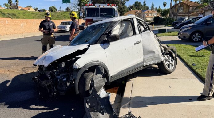 Driver Ejected on I-15; Empty Vehicle Launches Over Wall onto Residential Sidewalk The vehicle the rolled then launched over the barrier wall.